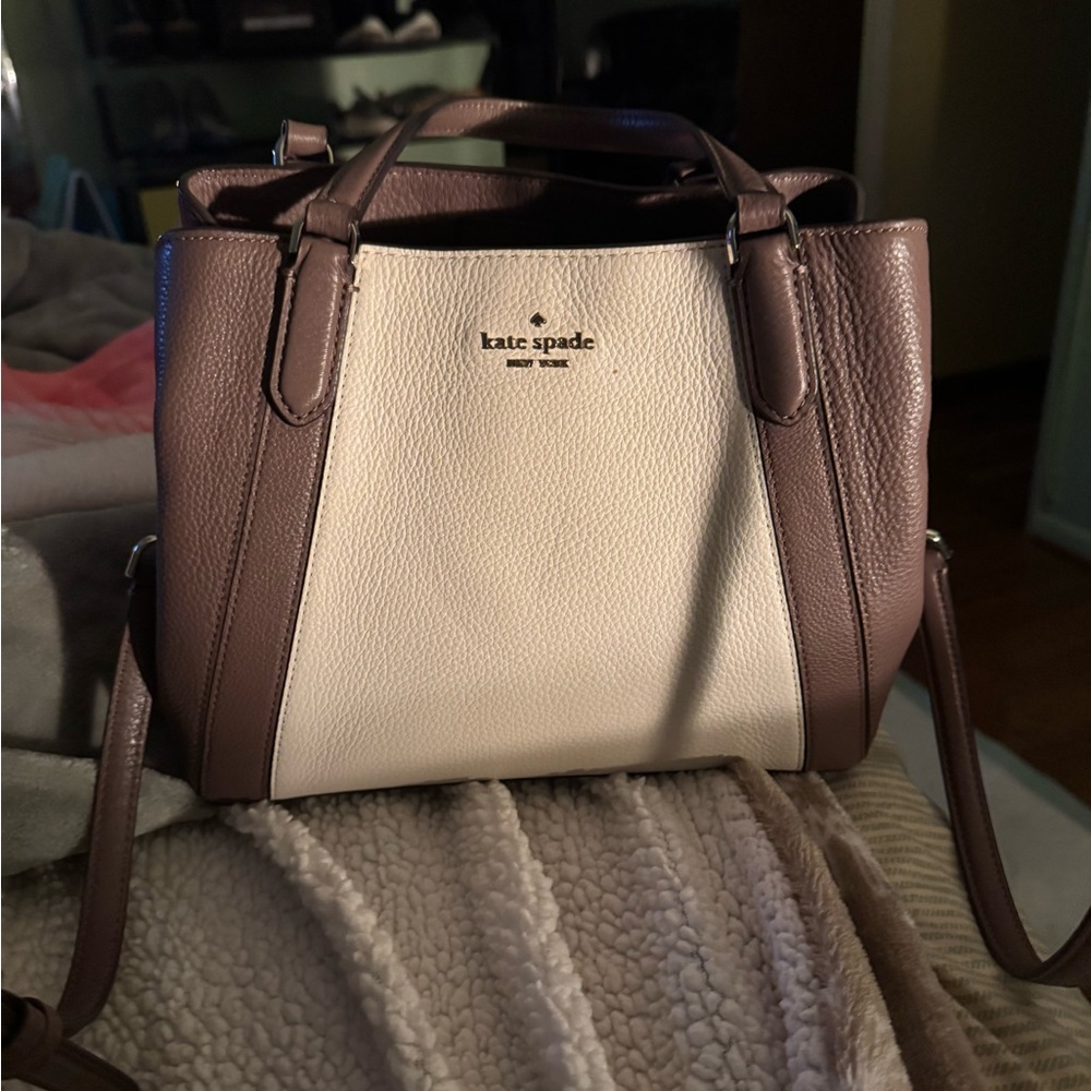 Kate Spade purse/ crossbody is. True beauty.
Only carried three times.